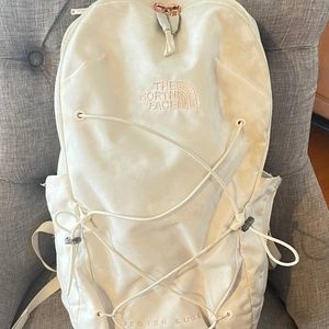 White and rose gold north face jester backpack